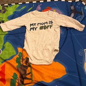 Tan onesie with words washed before sent